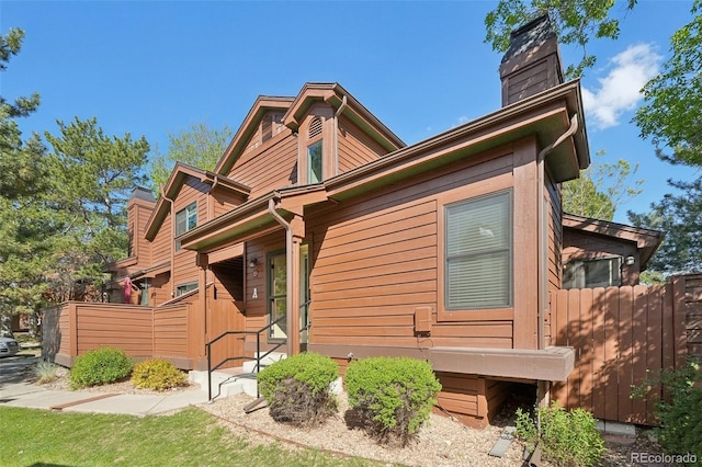 9455 W 81st Ave Unit A, Arvada, CO 80005 - back of house with a chimney