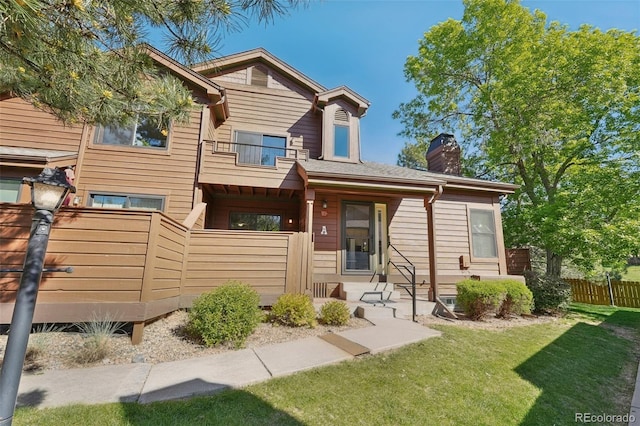 9455 W 81st Ave Unit A, Arvada, CO 80005 - view of front of house with a balcony and a chimney