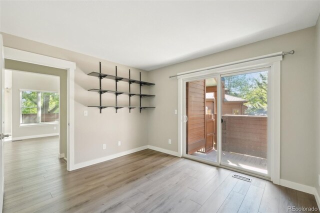 9455 W 81st Ave Unit A, Arvada, CO 80005 - empty room featuring wood finished floors and baseboards