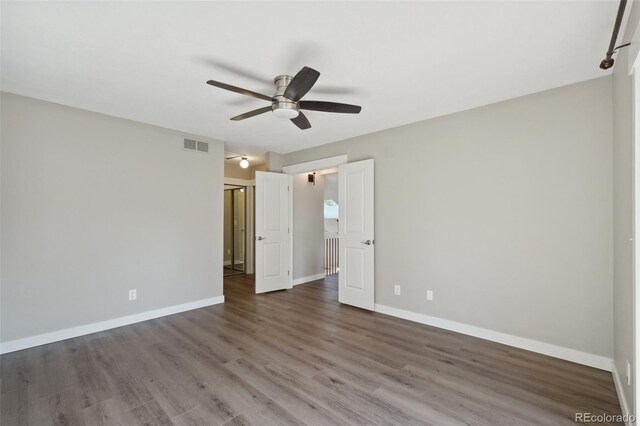 9455 W 81st Ave Unit A, Arvada, CO 80005 - unfurnished bedroom with wood finished floors, baseboards, and ceiling fan