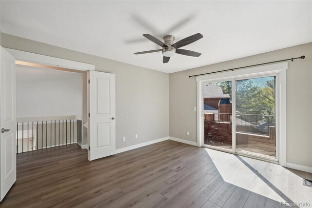 9455 W 81st Ave Unit A, Arvada, CO 80005 - empty room featuring wood finished floors, a ceiling fan, and baseboards