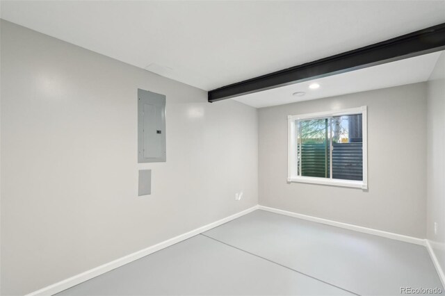 9455 W 81st Ave Unit A, Arvada, CO 80005 - empty room with electric panel, baseboards, beamed ceiling, recessed lighting, and finished concrete floors