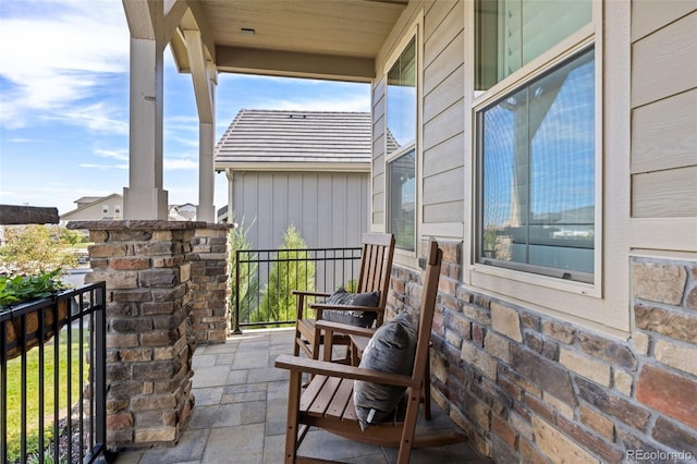 balcony featuring a porch