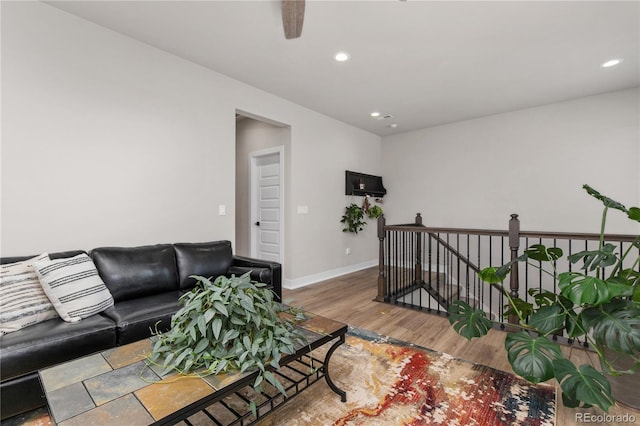 living room with a ceiling fan, baseboards, wood finished floors, and recessed lighting