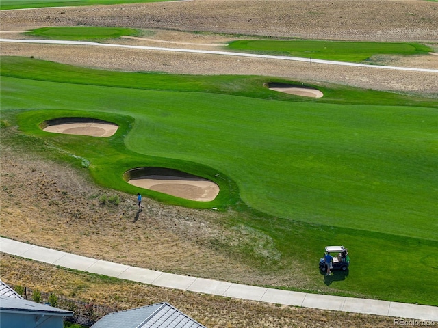 view of home's community featuring view of golf course