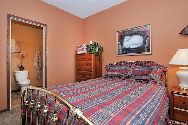 carpeted bedroom featuring connected bathroom