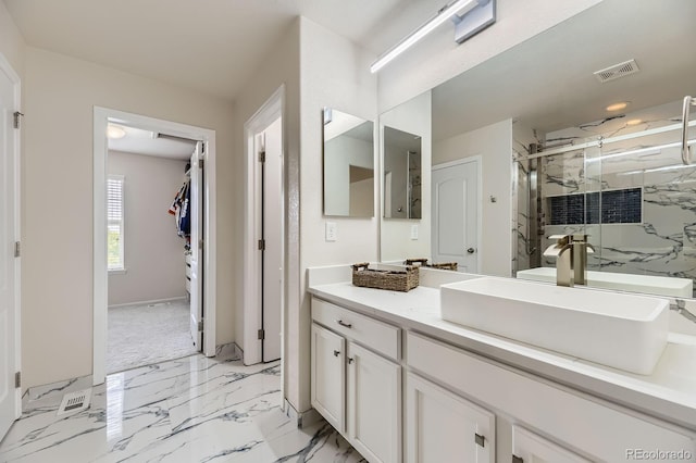 6108 S Harvest Ct, Aurora, CO 80016 - bathroom with a marble finish shower, vanity, and baseboards