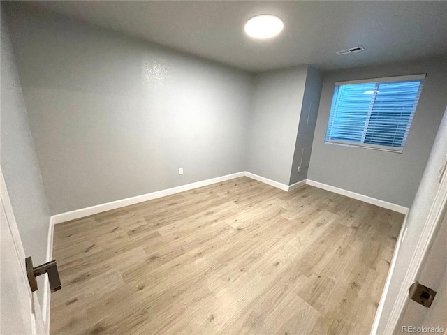 6108 S Harvest Ct, Aurora, CO 80016 - unfurnished room featuring wood finished floors and baseboards