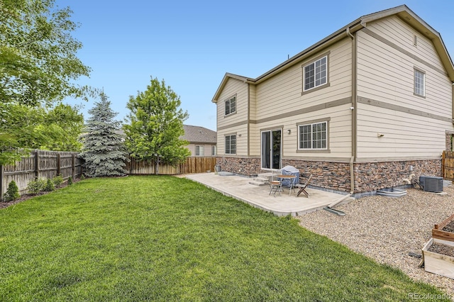 6108 S Harvest Ct, Aurora, CO 80016 - rear view of house featuring stone siding and a patio