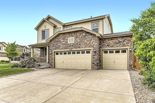 6108 S Harvest Ct, Aurora, CO 80016 - traditional home with stone siding, driveway, an attached garage, and covered porch