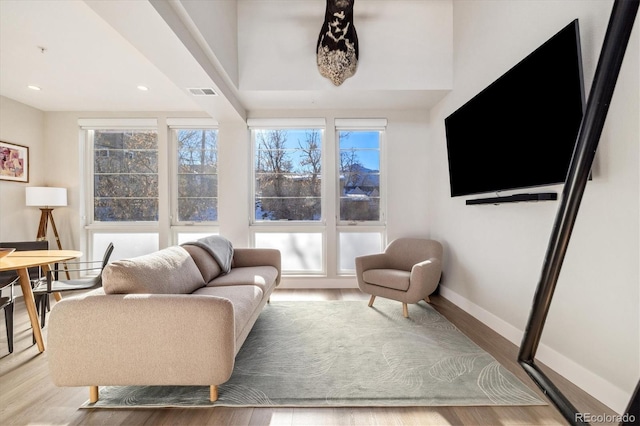living room with light hardwood / wood-style flooring