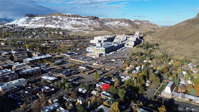 birds eye view of property with a mountain view