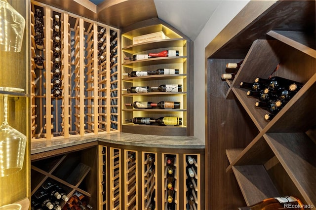 wine area featuring lofted ceiling