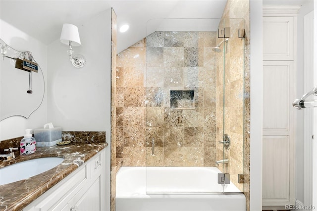 bathroom with vanity and shower / bath combination with glass door