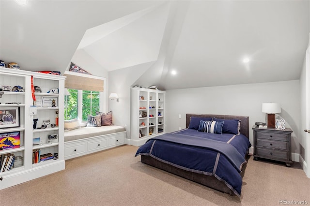 bedroom with lofted ceiling, baseboards, and light carpet