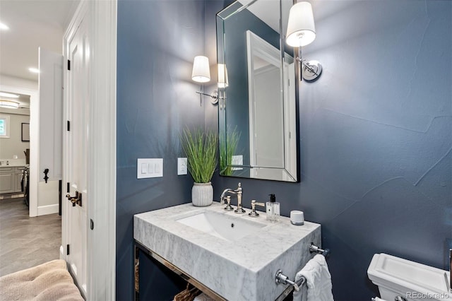 bathroom with recessed lighting, toilet, and vanity