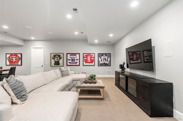 living area with recessed lighting and visible vents