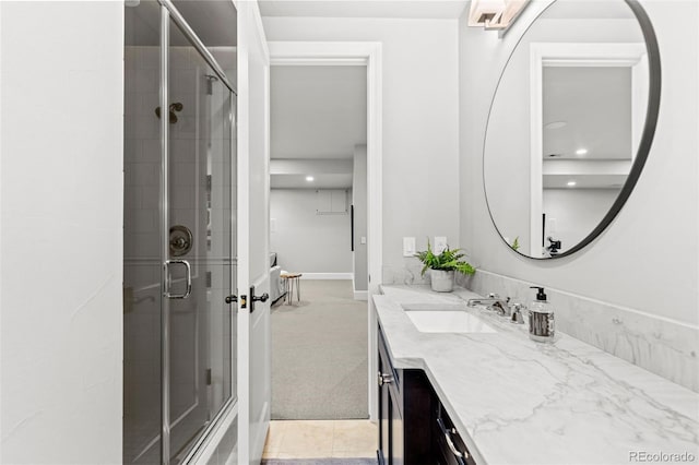 bathroom with vanity, a shower stall, and tile patterned floors