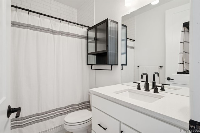 12270 W 57th Ave, Arvada, CO 80002 - bathroom featuring toilet, vanity, and a shower with curtain