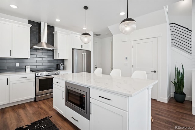 12270 W 57th Ave, Arvada, CO 80002 - kitchen with wall chimney exhaust hood, stainless steel appliances, backsplash, dark wood-style flooring, and recessed lighting