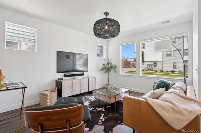 12270 W 57th Ave, Arvada, CO 80002 - living room featuring baseboards and wood finished floors