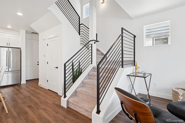 12270 W 57th Ave, Arvada, CO 80002 - stairs with wood finished floors, plenty of natural light, recessed lighting, and baseboards