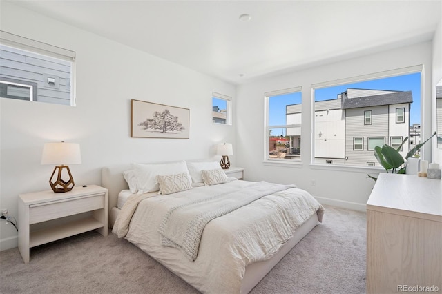 12270 W 57th Ave, Arvada, CO 80002 - bedroom with light colored carpet and baseboards