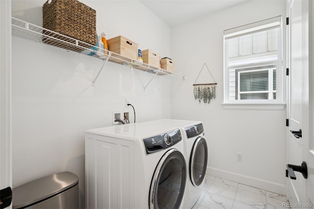 12270 W 57th Ave, Arvada, CO 80002 - laundry area featuring washing machine and dryer, light marble finish flooring, and baseboards