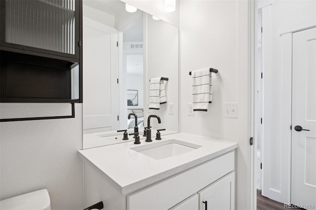 12270 W 57th Ave, Arvada, CO 80002 - half bath featuring toilet and vanity