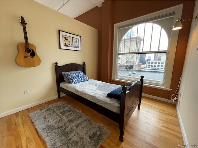 bedroom with hardwood / wood-style flooring