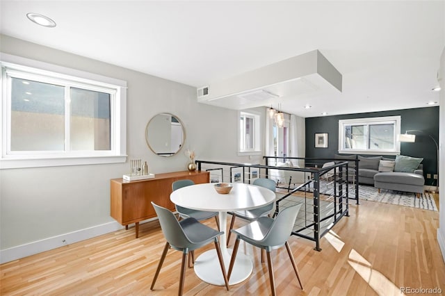 dining space with light wood finished floors, visible vents, recessed lighting, and baseboards