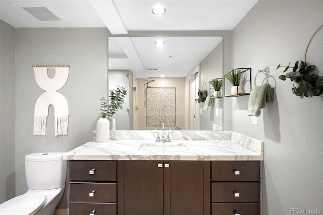 bathroom featuring vanity, visible vents, recessed lighting, walk in shower, and toilet