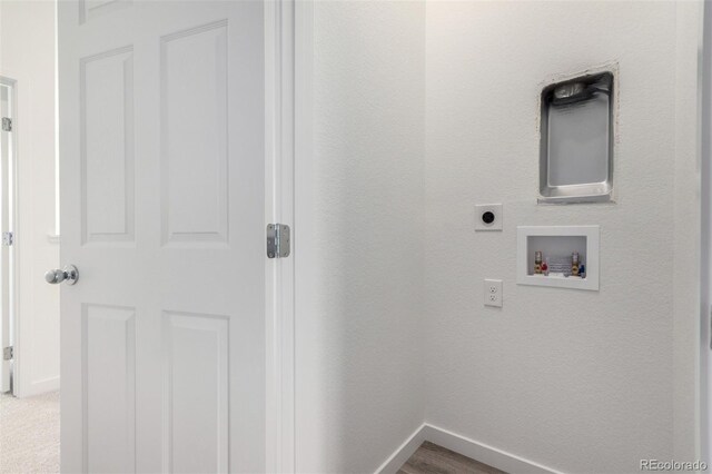 laundry room featuring electric dryer hookup, baseboards, and hookup for a washing machine