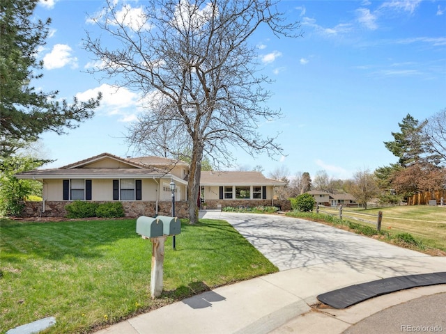 6490 S Pontiac Ct, Centennial, CO 80111 - ranch-style house with concrete driveway, stucco siding, stone siding, and a front lawn