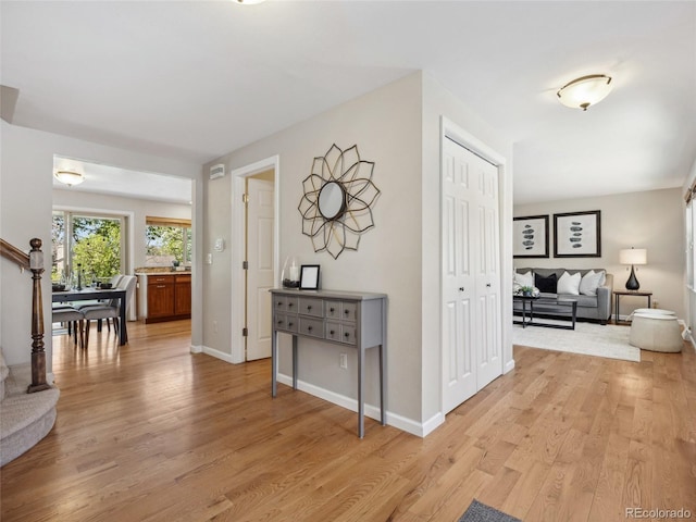 6490 S Pontiac Ct, Centennial, CO 80111 - hall featuring baseboards and light wood-style floors