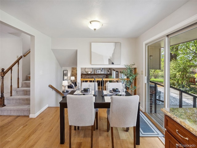 6490 S Pontiac Ct, Centennial, CO 80111 - dining space with baseboards, stairs, and light wood-style flooring