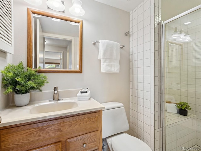 6490 S Pontiac Ct, Centennial, CO 80111 - full bathroom with vanity, toilet, and a stall shower