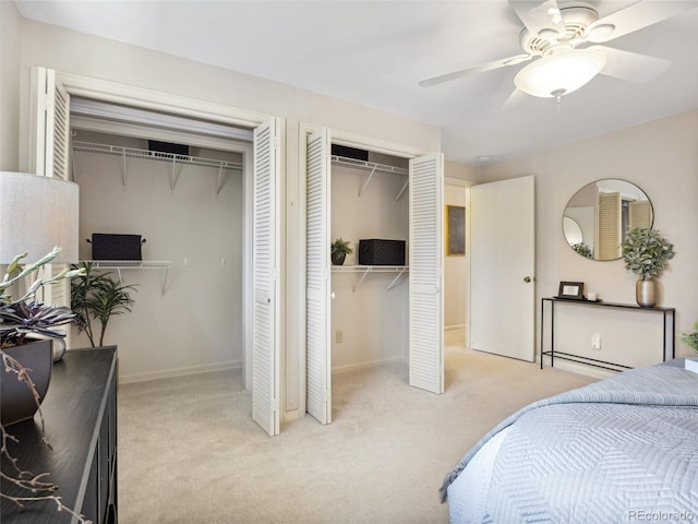 6490 S Pontiac Ct, Centennial, CO 80111 - bedroom featuring carpet flooring, a ceiling fan, baseboards, and multiple closets