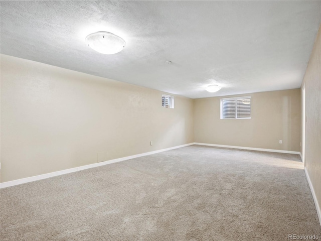 6490 S Pontiac Ct, Centennial, CO 80111 - basement with carpet flooring, a textured ceiling, and baseboards