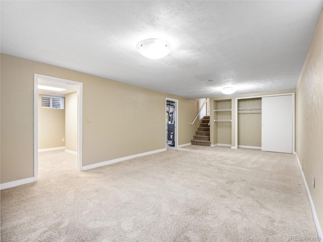 6490 S Pontiac Ct, Centennial, CO 80111 - finished basement with stairway, carpet floors, and a textured ceiling