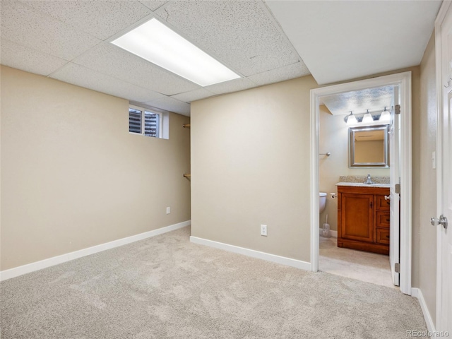 6490 S Pontiac Ct, Centennial, CO 80111 - interior space with baseboards, a drop ceiling, light carpet, and a sink