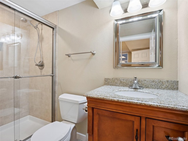 6490 S Pontiac Ct, Centennial, CO 80111 - bathroom with vanity, toilet, and a stall shower
