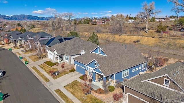 bird's eye view with a residential view and a mountain view