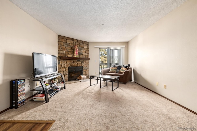 carpeted living room featuring a textured ceiling and a fireplace