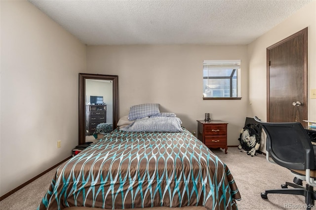 carpeted bedroom with a textured ceiling