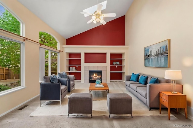3371 Bexley Dr, Colorado Springs, CO 80922 - living area with high vaulted ceiling, built in shelves, baseboards, ceiling fan, and a fireplace