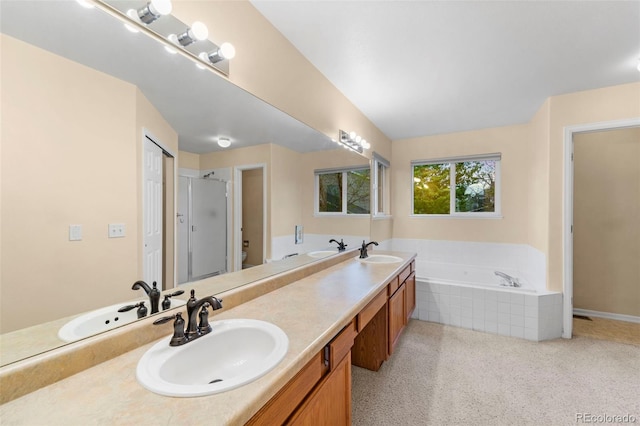 3371 Bexley Dr, Colorado Springs, CO 80922 - bathroom featuring a garden tub, a stall shower, and double vanity