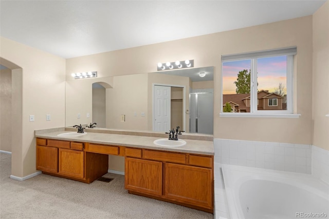 3371 Bexley Dr, Colorado Springs, CO 80922 - bathroom with a bath and double vanity