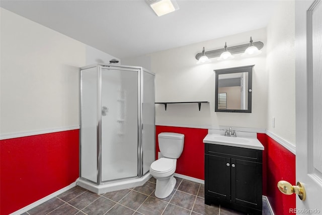3371 Bexley Dr, Colorado Springs, CO 80922 - full bath with a shower stall, tile patterned flooring, toilet, and vanity