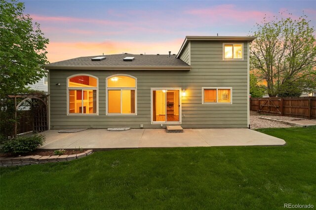 3371 Bexley Dr, Colorado Springs, CO 80922 - rear view of house featuring a patio and a shingled roof